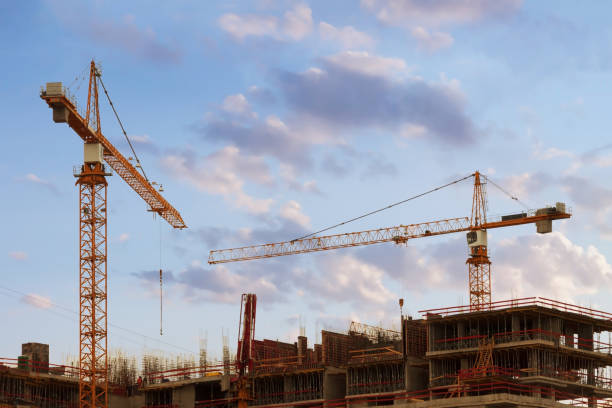 Civil engineering of building construction site with tower block and crane