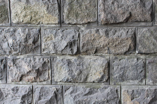 istock granite brick wall details texture background. Natural architecture material grunge  pattern 1004475630