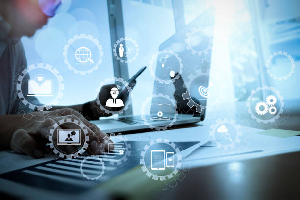 istock business documents on office table with smart phone and digital tablet and graph business diagram and man working in the background 1004476246