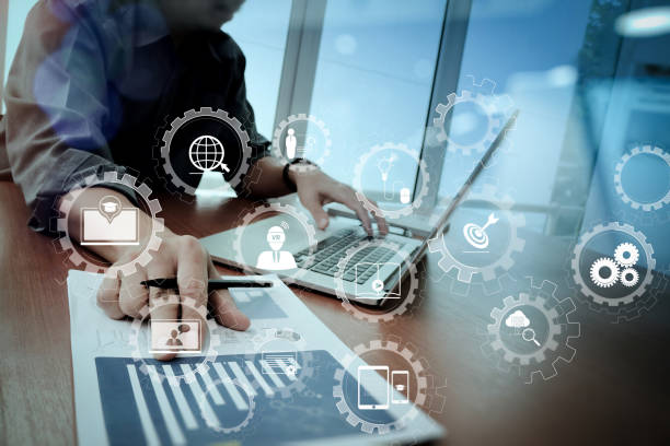 istock business documents on office table with smart phone and digital tablet and graph business diagram and man working in the background 1004480054