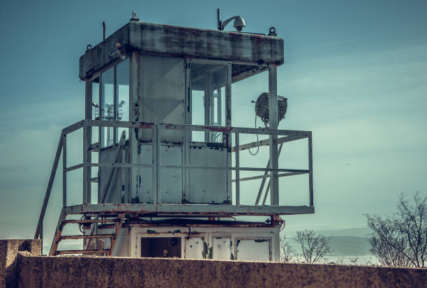 Close up view of old metal rusted watchtower in old abandoned industrial zone.