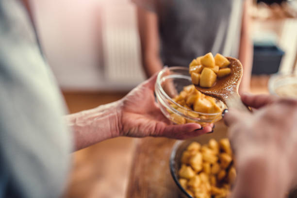 istock Woman serving baked apple with cinnamon 1004494270