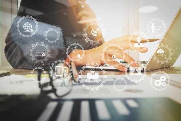 istock business documents on office table with laptop computer with smart phone and graph business diagram and man working in the background 1004499574