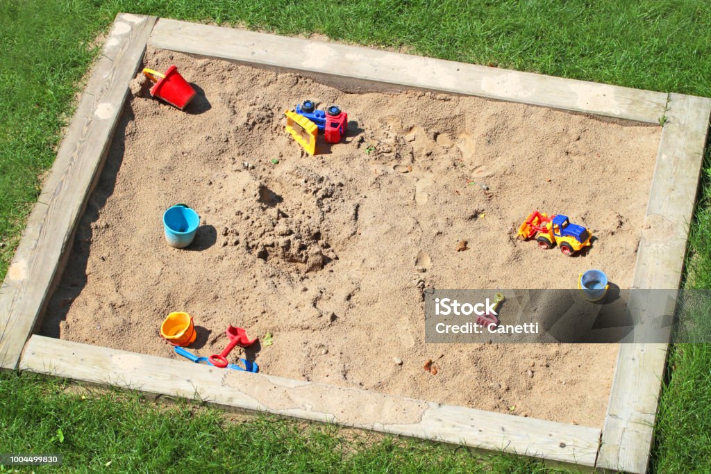 sandbox sandbox with plastic toys Sandbox Stock Photo