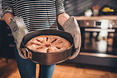 Woman holding freshly baked apple pie