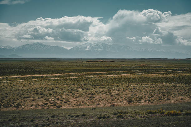 istock Highway street empty with green Kazakhstan Steppe view 1004508112