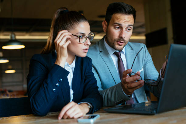 istock Young businesswoman and man having a conversation in restaurant 1004513376
