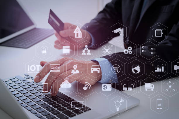 istock businessman making credit card purchase online with laptop computer on modern desk 1004513394