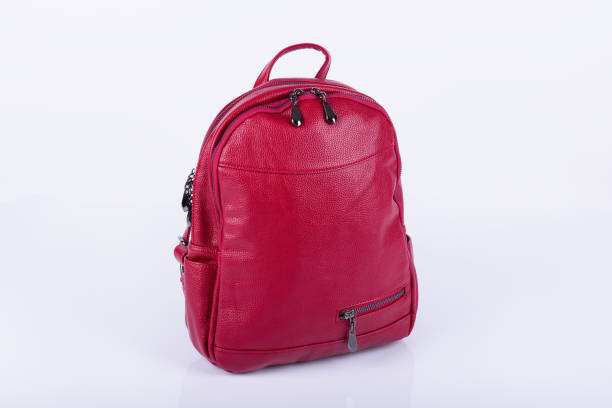 istock Red leather fashionable female backpack on white background 1004518322