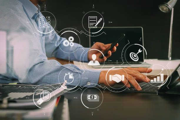 istock businessman working with smart phone and digital tablet and laptop computer in modern office 1004518530