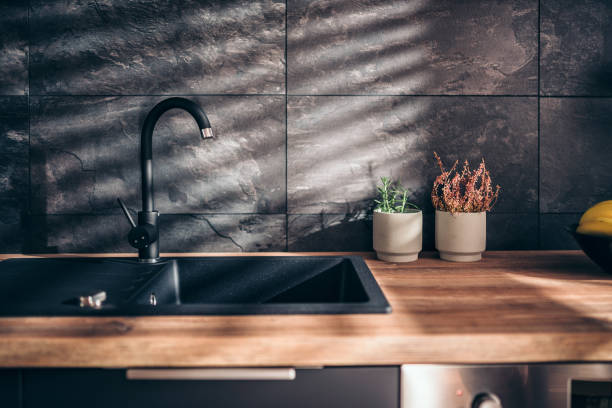 Modern black kitchen Modern kitchen with black sink and fronts kitchen sink photos stock pictures, royalty-free photos & images