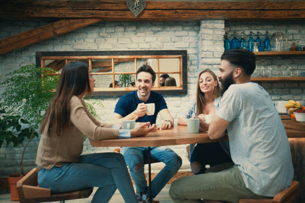 istock Four friends have coffee time 1004534206