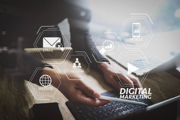 istock Website designer working digital tablet dock keyboard and computer laptop with smart phone and graphics design diagram on mable desk as concept 1004534672