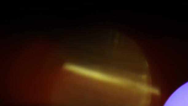 istock Real Lens Flare Shot in Studio over Black Background 1004539816