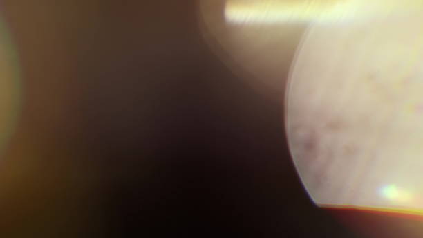 istock Real Lens Flare Shot in Studio over Black Background 1004539960