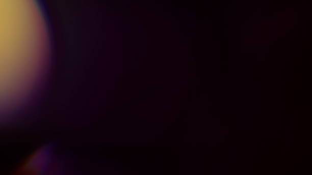 istock Real Lens Flare Shot in Studio over Black Background 1004540542