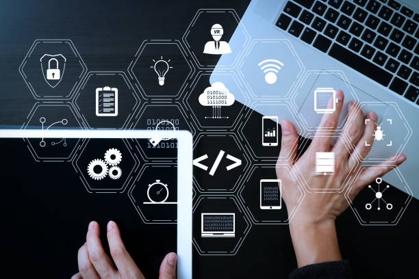 istock cyber security internet and networking concept.Businessman hand working with  laptop computer and digital tablet background 1004542930