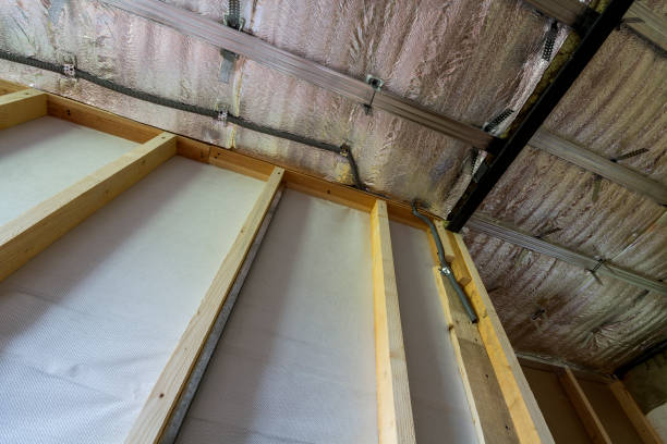 istock Room under construction and renovation with silver aluminum foil on walls and ceiling and wooden timber frame for future partition wall. Professional reconstruction and insulation concept. 1004546424
