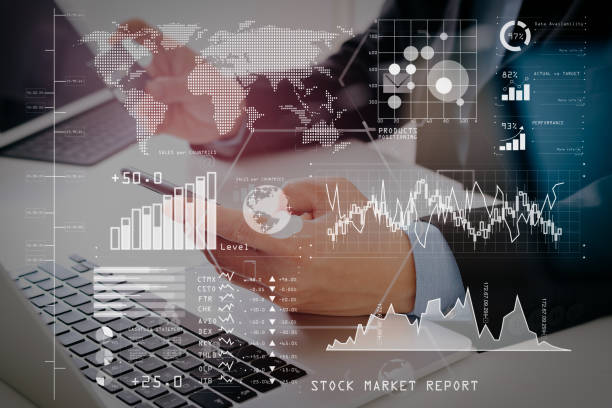 istock businessman making credit card purchase online with mobile phone and laptop computer on modern desk 1004546688