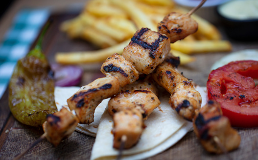 Tasty Grilled Chicken Sish on wooden plate