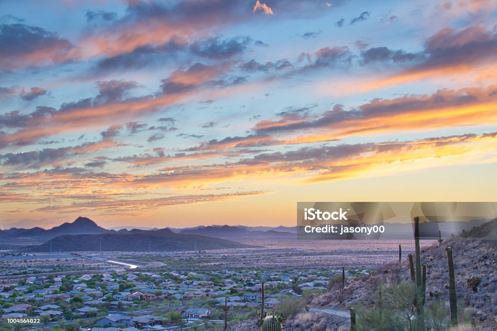 Arizona Sunset and Hiking Trail A hiking trail on the side of a mountain heading into an Arizona sunset. Phoenix - Arizona Stock Photo