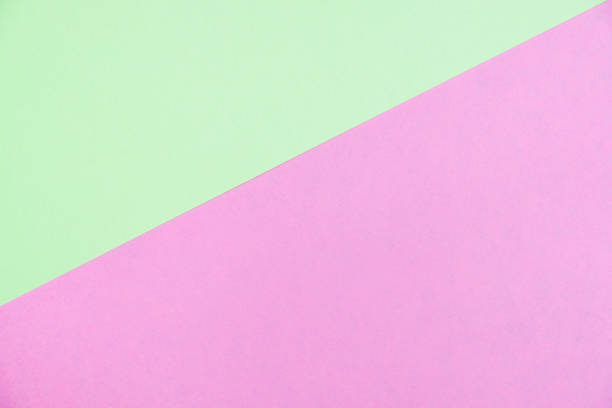 istock Pastel colored paper flat lay top view, background texture, green and pink 1004564368