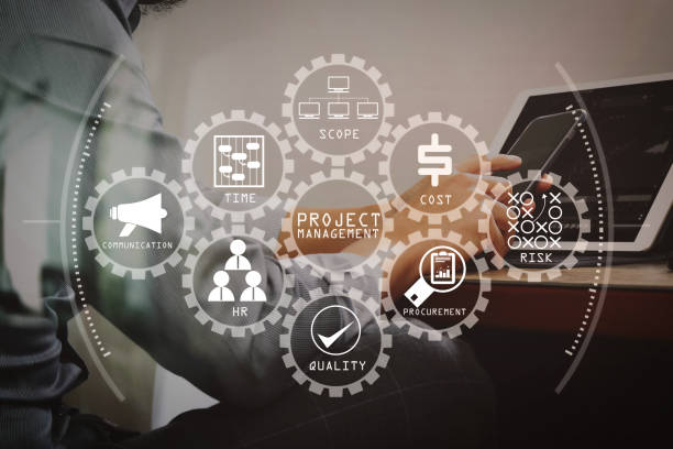 istock success businessman hand using smart phone,digital tablet docking smart keyboard on wood desk 1004591936