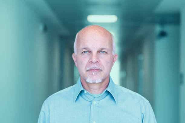 istock Front view of mature man looking stoic 1004592054