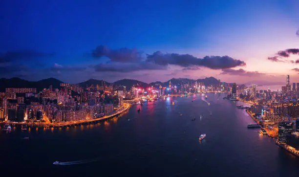 Aerial view of Hong Kong City in magic hour, shooting from drone angle.