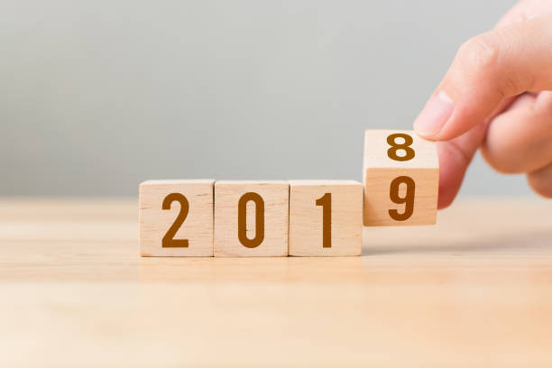 New year 2018 change to 2019 concept. Hand flip over wood cube block New year 2018 change to 2019 concept. Hand flip over wood cube block 2018 calendar stock pictures, royalty-free photos & images