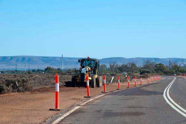 istock Grader clearing the bush along side of highway 1004615624