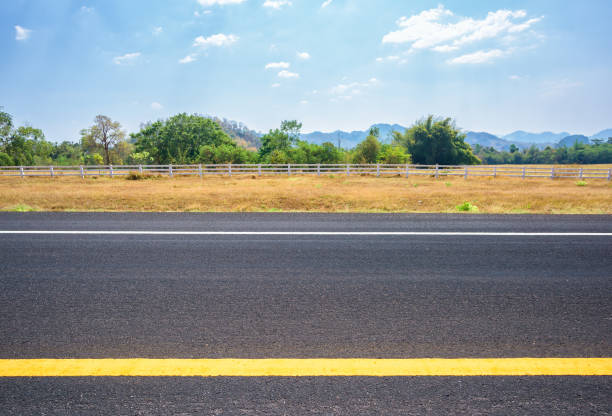 istock Asphalt road and countryside views 1004630002