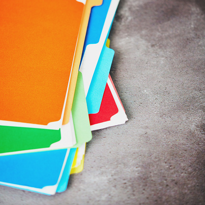 Colorful folders filled with paperwork