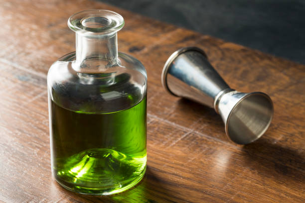 Alcoholic Green Absinth Apertif Alcoholic Green Absinth Apertif in a Bottle for Cocktails absinthe spoon stock pictures, royalty-free photos & images
