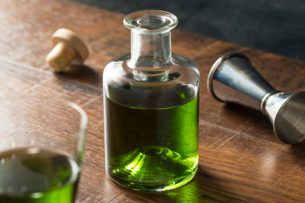Alcoholic Green Absinth Apertif Alcoholic Green Absinth Apertif in a Bottle for Cocktails absinthe spoon stock pictures, royalty-free photos & images