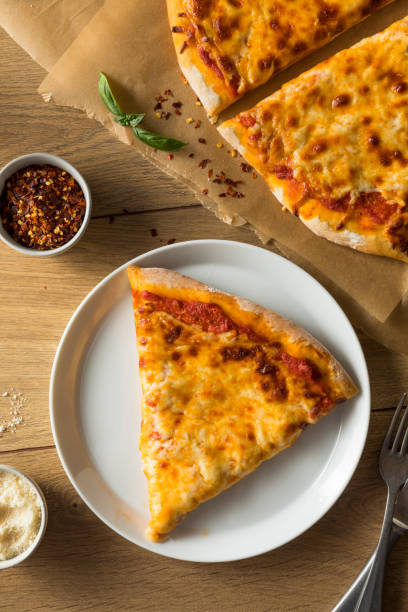 istock Homemade Greasy New York Cheese Pizza 1004654666