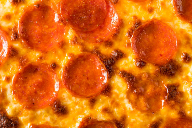 istock Homemade Greasy Pepperoni New York Pizza 1004654736