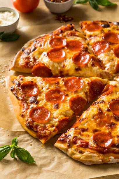 istock Homemade Greasy Pepperoni New York Pizza 1004656930