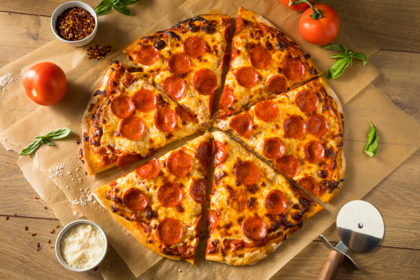istock Homemade Greasy Pepperoni New York Pizza 1004657004