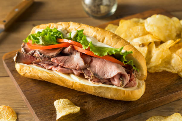 Homemade Roast Beef Deli Sandwich Homemade Roast Beef Deli Sandwich with Lettuce and Tomato submarine photos stock pictures, royalty-free photos & images