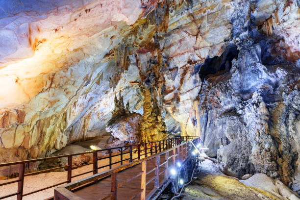 istock Wooden walkway through scenic natural corridor, Paradise Cave 1004667404