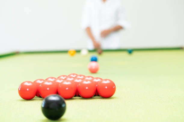 istock Young man playing snooker in the club. 1004681330