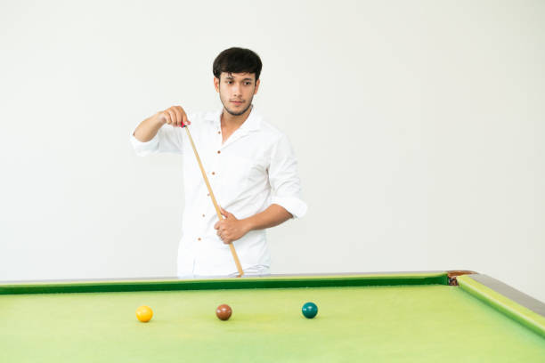 istock Young man playing snooker in the club. 1004681348