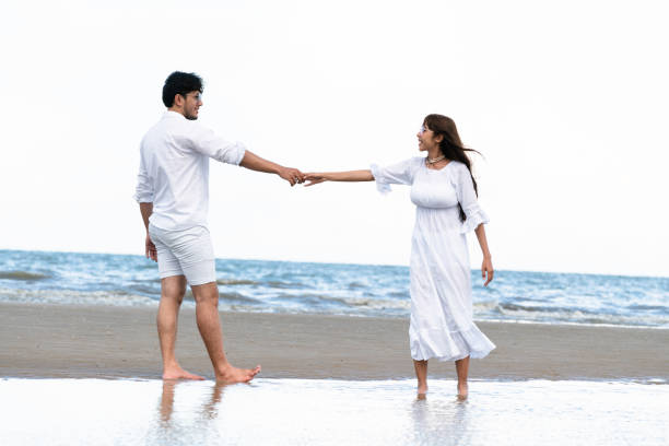 istock Couple going honeymoon on tropical beach in summer 1004681406