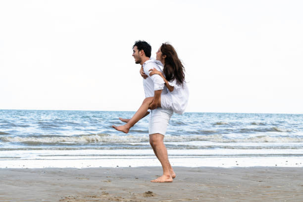 istock Couple going honeymoon on tropical beach in summer 1004681418