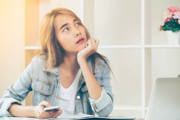 istock Creative woman thinking or planning in the office. 1004681948