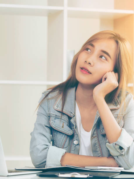 Creative woman thinking or planning in the office.