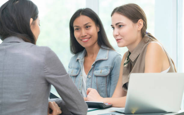 istock Multicultural businesswomen in group meeting. 1004682118