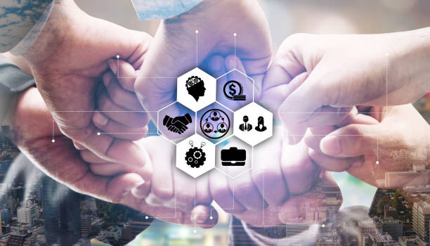 istock Business people team joining hands. 1004682250