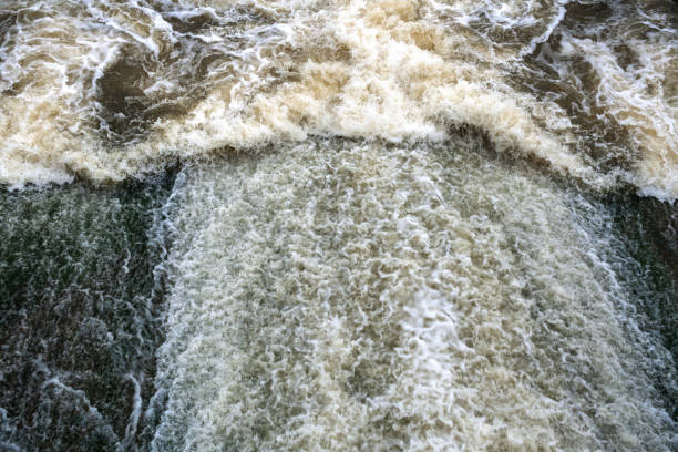 istock Top view to powerful flow of foaming water. Selective focus. 1004685042